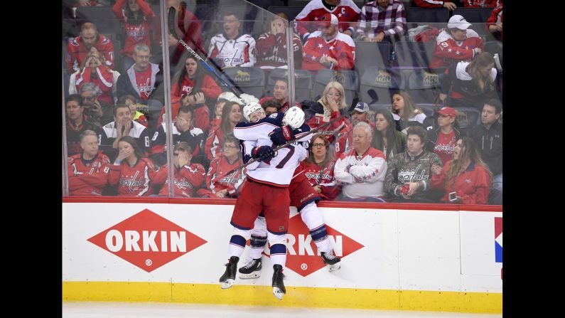 Columbus Blue Jackets left wing Matt Calvert, 11, celebrates his game-winning goal with center Brandon Dubinsky, 17, in overtime in game 2 of an NHL first-round hockey playoff series against the Washington Capitals on Sunday, April 15, in Washington. The Blue Jackets won 5-4 in overtime.