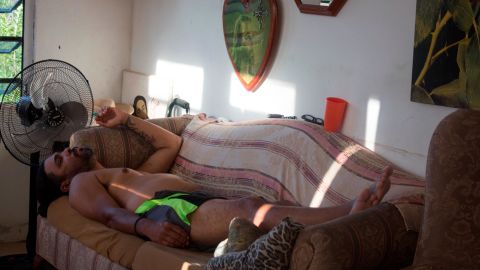 Joe Garcia, who has diabetes and kidney failure, falls asleep after a trip to the dialysis clinic. He will have one day of rest before traveling again for treatment.