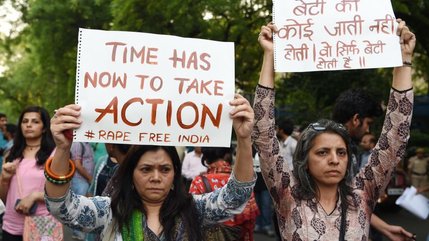 Indian demonstrators hold placards during a silent protest 'Not In My Name' in support of rape victims following high profile cases in Jammu and Kashmir and Uttar Pradesh states, in New Delhi on April 15, 2018.
Indian police have made another arrest after the alleged rape of a teenager by a ruling party politician sparked protests across the country, federal investigators said April 15.
 / AFP PHOTO / Sajjad HUSSAIN        (Photo credit should read SAJJAD HUSSAIN/AFP/Getty Images)