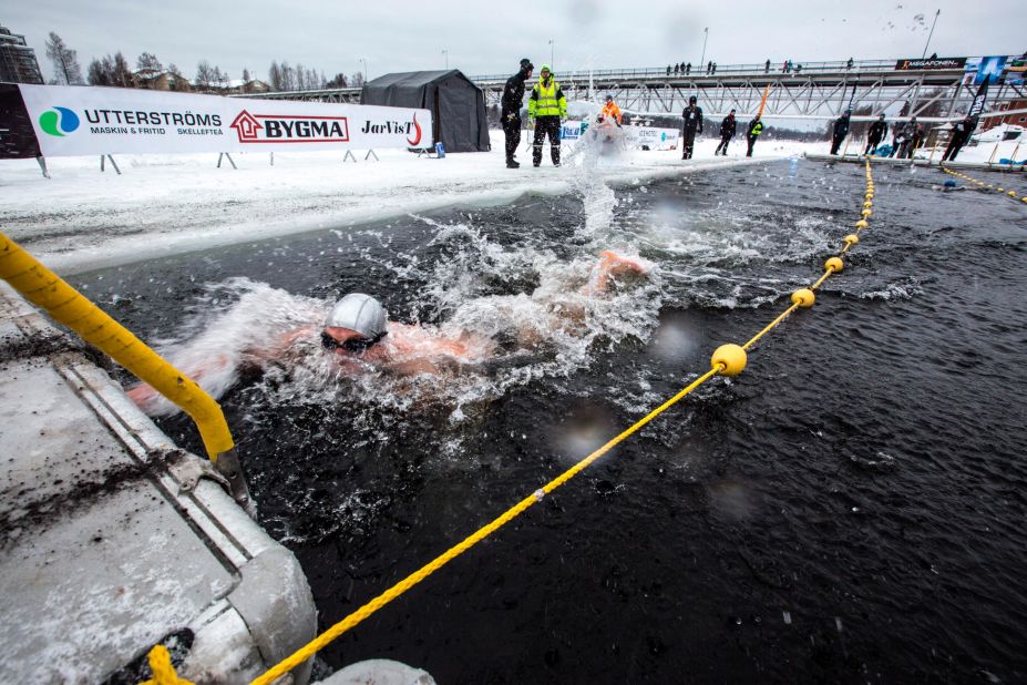The water temperature is 0.2 Celsius (32 Fahrenheit), just shy of freezing. The ice on the surface, more than 2 feet thick, had been cut by a team of laborers with chainsaws.