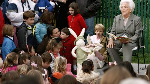 Former first lady and mother of President George W. Bush, Barbara Bush reads during the annual Easter Egg Roll at the White House on March 24, 2008 in Washington, DC.