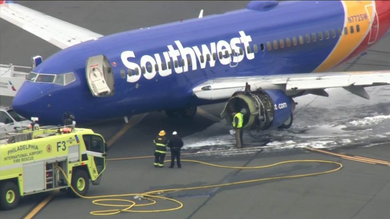 A window is missing from the plane as it sits on the tarmac Tuesday at the Philadelphia airport. 