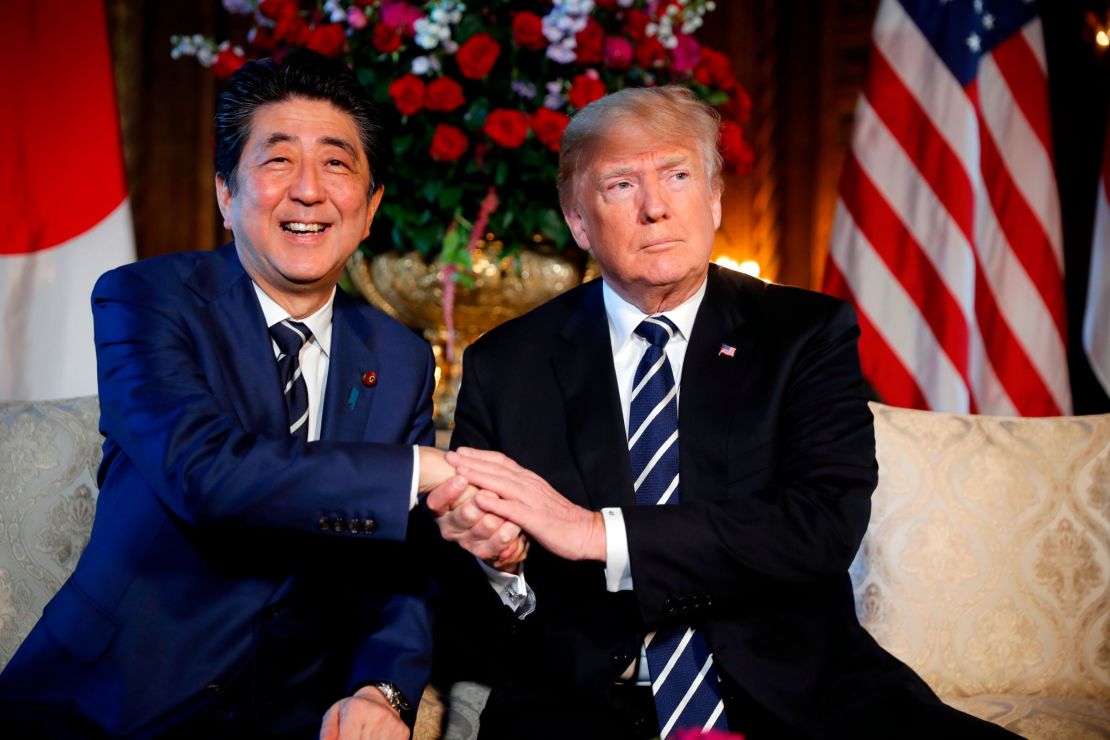 President Donald Trump and Japanese Prime Minister Shinzo Abe shake hands during their meeting at Trump's private Mar-a-Lago club, Tuesday, April 17, 2018, in Palm Beach, Fla. 