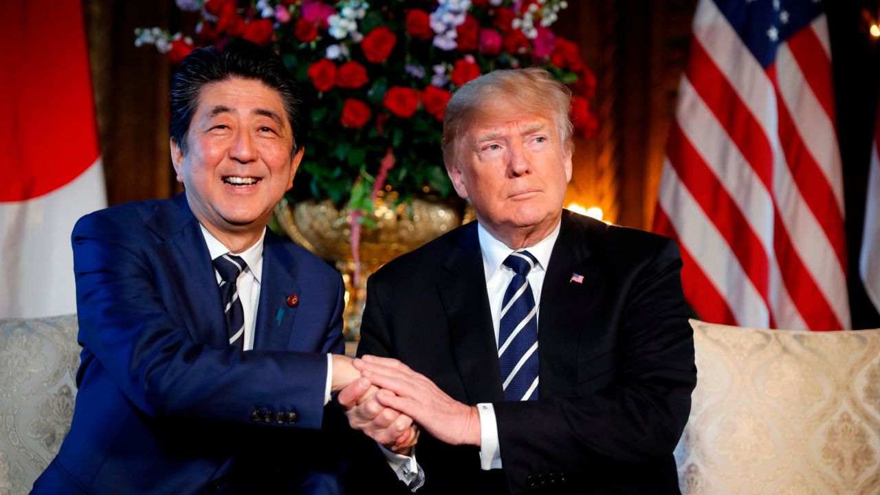 President Donald Trump and Japanese Prime Minister Shinzo Abe shake hands during their meeting at Trump's private Mar-a-Lago club, Tuesday, April 17, 2018, in Palm Beach, Fla. 