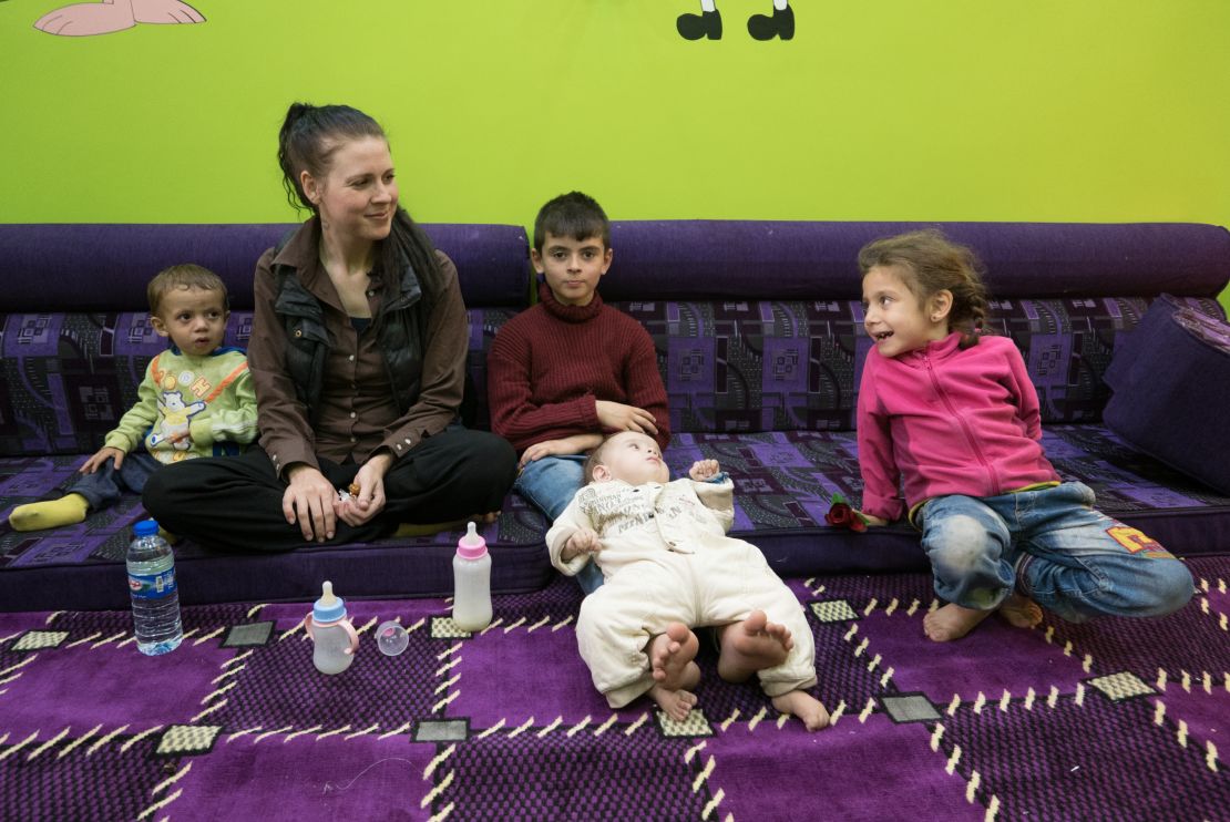 Samantha Sally speaks to CNN in northern Syria with her children. 