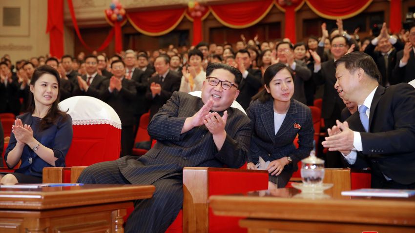 In this Monday, April 16, 2018, photo provided Tuesday, April 17, 2018, by the North Korean government, North Korean leader Kim Jong Un, claps while watching a performance of a Chinese art troupe with his wife Ri Sol Ju, left, and Song Tao, right, head of the ruling Communist Party's International Department, at East Pyongyang Grand Theater in Pyongyang, North Korea. Kim met the high-ranking Chinese diplomat, amid a flurry of diplomacy following Kim's surprise visit to Beijing. Independent journalists were not given access to cover the event depicted in this image distributed by the North Korean government. The content of this image is as provided and cannot be independently verified. Korean language watermark on image as provided by source reads: "KCNA" which is the abbreviation for Korean Central News Agency. (Korean Central News Agency/Korea News Service via AP)