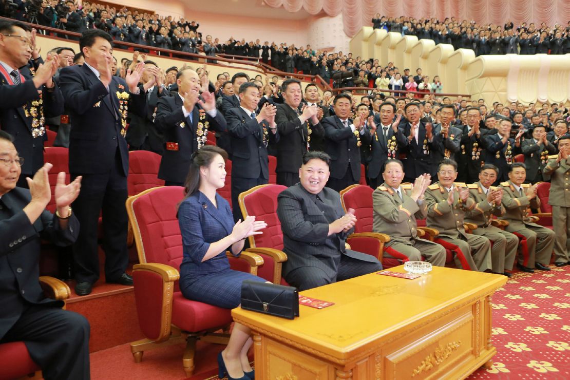 North Korean leader Kim Jong Un and his wife Ri Sol-Ju, seen in an undated handout image from North Korean state media, attending an art performance in Pyongyang. 