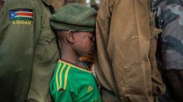 TOPSHOT - Newly released child soldiers wait in a line for their registration during the release ceremony in Yambio, South Sudan, on February 7, 2018.
More than 300 child soldiers, including 87 girls, have been released in South Sudan's war-torn region of Yambio under a programme to help reintegrate them into society, the UN said on on Februar y 7, 2018. A conflict erupted in South Sudan little more than two years after gained independence from Sudan in 2011, causing tens of thousands of deaths and uprooting nearly four million people. The integration programme in Yambio, which is located in the south of the country, aims at helping 700 child soldiers return to normal life. / AFP PHOTO / Stefanie Glinski        (Photo credit should read STEFANIE GLINSKI/AFP/Getty Images)