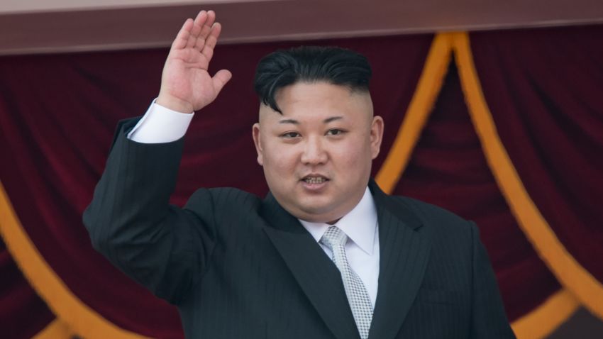 North Korean leader Kim Jong-Un waves from a balcony of the Grand People's Study house following a military parade marking the 105th anniversary of the birth of late North Korean leader Kim Il-Sung, in Pyongyang on April 15, 2017.
Kim saluted as ranks of goose-stepping soldiers followed by tanks and other military hardware paraded in Pyongyang for a show of strength with tensions mounting over his nuclear ambitions. / AFP PHOTO / ED JONES (Photo credit should read ED JONES/AFP/Getty Images)