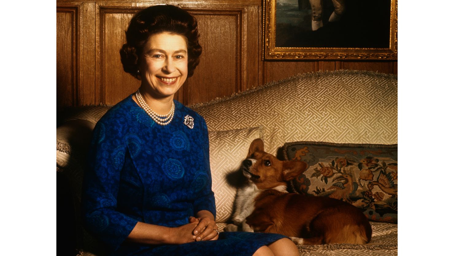Queen Elizabeth II pictured with one of her pet corgis in 1970. 