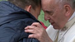 On Sunday (April 15) Pope Francis comforted a child who lost his father during a visit to a poor district of Rome, saying God has a "dad's heart".
During a meeting Francis answered questions from children and one of them, Emanuele, was too shy to speak at the microphone so the pontiff decided to invite him onto stage. The child started crying and hugged Francis and whispered his question into the pope's ears, saying he was afraid that his father, who was an atheist, could not go to heaven.
Francis comforted Emanuele and said that it is God who decides who goes to heaven and that, since God has a 'dad's heart', he will not abandon the boy's dad, even if he was not a believer.
The leader of the world's 1.2 billion Catholics visited the parish of St. Paul of the Cross in Rome's Corviale neighbourhood and met with children of the poor district of the Italian capital and celebrated Mass for the parish community.
