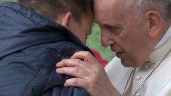 On Sunday (April 15) Pope Francis comforted a child who lost his father during a visit to a poor district of Rome, saying God has a "dad's heart".
During a meeting Francis answered questions from children and one of them, Emanuele, was too shy to speak at the microphone so the pontiff decided to invite him onto stage. The child started crying and hugged Francis and whispered his question into the pope's ears, saying he was afraid that his father, who was an atheist, could not go to heaven.
Francis comforted Emanuele and said that it is God who decides who goes to heaven and that, since God has a 'dad's heart', he will not abandon the boy's dad, even if he was not a believer.
The leader of the world's 1.2 billion Catholics visited the parish of St. Paul of the Cross in Rome's Corviale neighbourhood and met with children of the poor district of the Italian capital and celebrated Mass for the parish community.