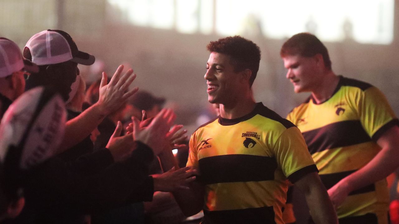 Houston SaberCats' center Malacchi Esdale greets fans after a pre-season exhibition game. 