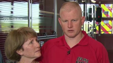 Andrew Needum speaks Thursday at a news conference with his mother at his side.