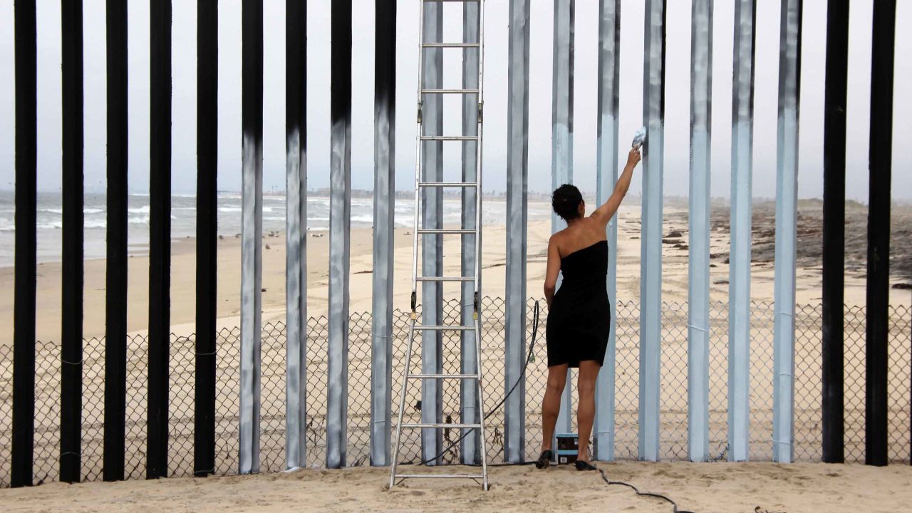 Mexican-born artist Ana Teresa Fernandez created her mural "Erasing the Border" in 2011 by painting sections of the fence the same color as the sky, creating the illusion that it is missing.