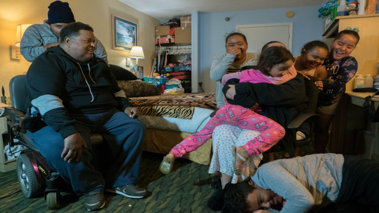 Fourteen familiy members live in several rooms at the Baymont Inn and Suites.