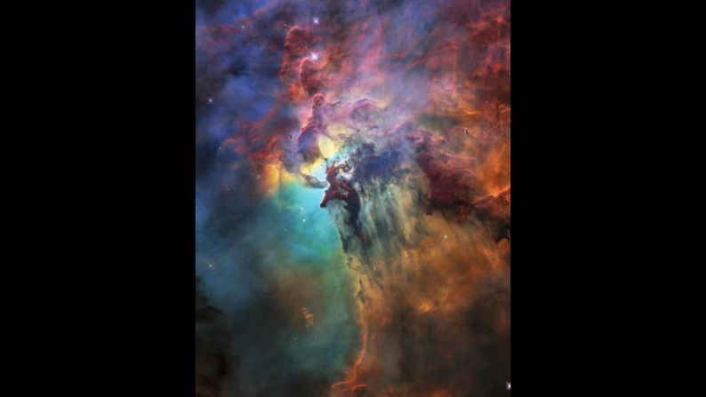 The NASA/ESA Hubble Space Telescope is celebrating its 28th anniversary in space with this stunning and colorful image of the Lagoon Nebula 4,000 light-years from Earth. While the whole nebula is 55 light-years across, this image only reveals a portion of about four light-years.