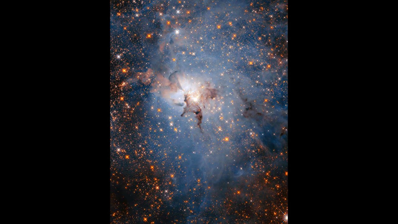 This is a more star-filled view of the Lagoon Nebula, using Hubble's infrared capabilities. The reason you can see more stars is because infrared is able to cut through the dust and gas clouds to reveal the abundance of both young stars within the nebula, as well as more distant stars in the background. 