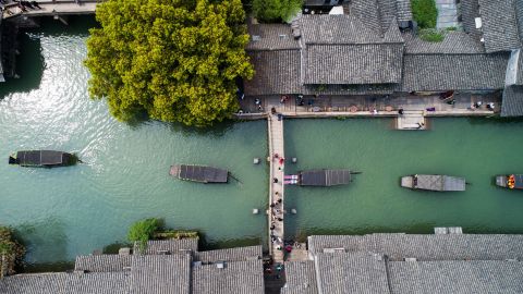 <strong>Wuzhen, China:</strong> In the town of Wuzhen in Tongxiang, Zhejiang Province, a boat procession is held on April 1 to celebrate Cansheng, the patron god of silkworms. 