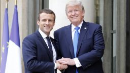PARIS, FRANCE - JULY 13:  French President Emmanuel Macron welcomes US President Donald Trump prior to a meeting at the Elysee Presidential Palace on July 13, 2017 in Paris, France. As part of the commemoration of the 100th anniversary of the entry of the United States of America into World War I, US President, Donald Trump will attend tomorrow at the Bastille Day military parade.  (Photo by Thierry Chesnot/Getty Images)