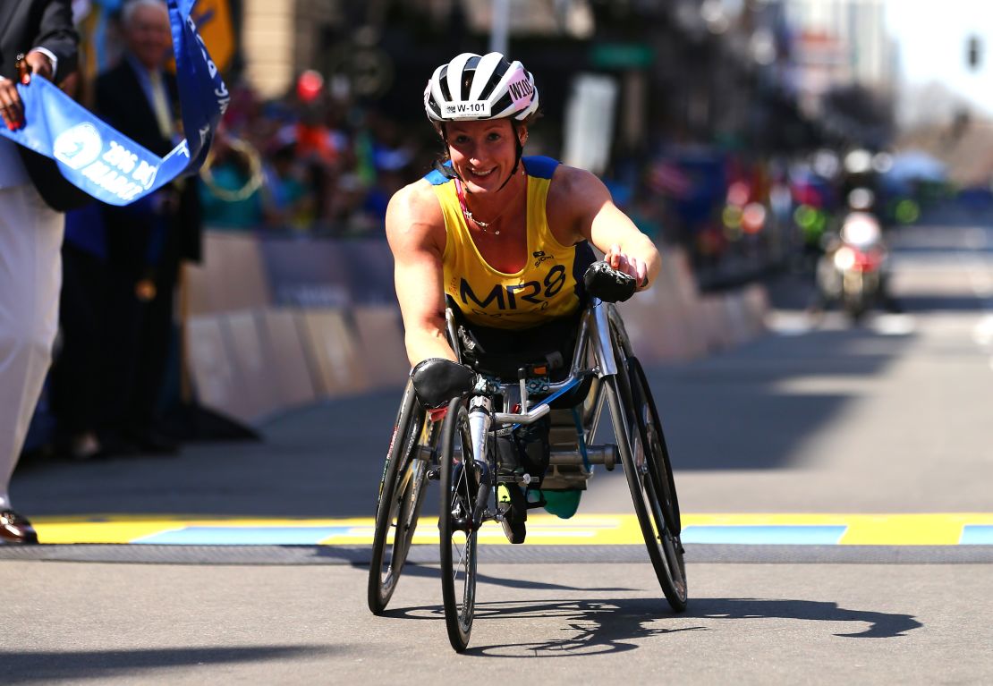 Tatyana McFadden  crosses the finish line to win the women's push rim wheelchair race in the Boston Marathon in 2016.