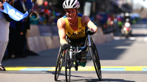 Tatyana McFadden  crosses the finish line to win the women's push rim wheelchair race in the Boston Marathon in 2016.