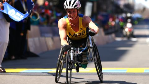 Tatyana McFadden crosses the finish line to win the women's push rim wheelchair race in the Boston Marathon in 2016.