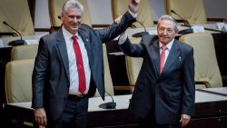 HAVANA, CUBA - APRIL 19: Former Cuban President Raul Castro raises the arm of newly elected Cuban President Miguel Diaz-Canel during the National Assembly at Convention Palace on April 19, 2018 in Havana, Cuba Diaz-Canel will be the first non-Castro Cuban president since 1976. Raul Castro steps down after 12 years in power. (AFP Adalberto Roque/Pool/Getty Images)