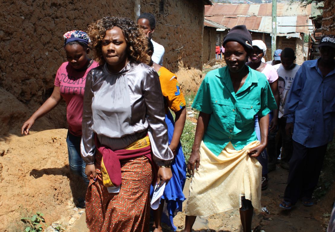 Phyllis Omido walks through the village of Owino Uhuru. She has been keeping a close eye on the lead exposure that has plagued this settlement since a nearby smelter began operations in 2007. 