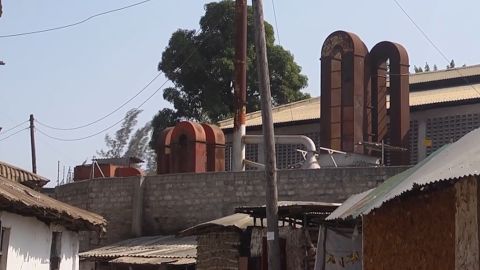 The chimneys of a lead smelting factory loom over the village of Owino Uhuru. The factory spewed lead-laden smoke and effluent into the village, in and off, from 2007-2014.