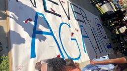 Stoneman Douglas High School students who participated in the walkout signed a #NeverAgain banner that will be sent to Columbine High School.