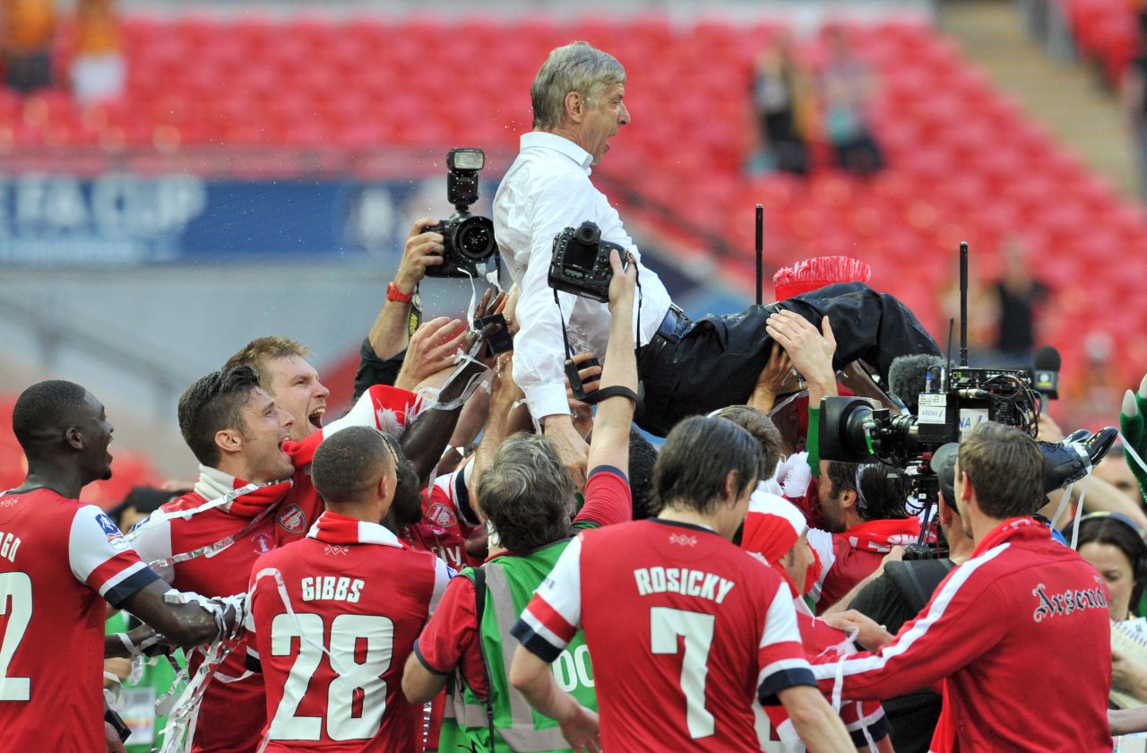 Then finally, after a nine-year drought, Arsenal won silverware once again after beating Hull City in a gripping 2014 FA Cup final. Arsenal players carried their French manager as they celebrated after the match.