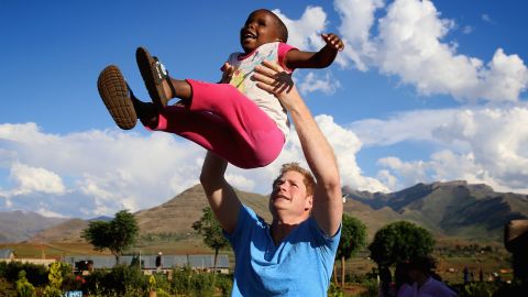 Prince Harry has a natural affinity with children, photographer Chris Jackson explains. "He connects with them in a very unique way and gets stuck in with whatever they're doing."