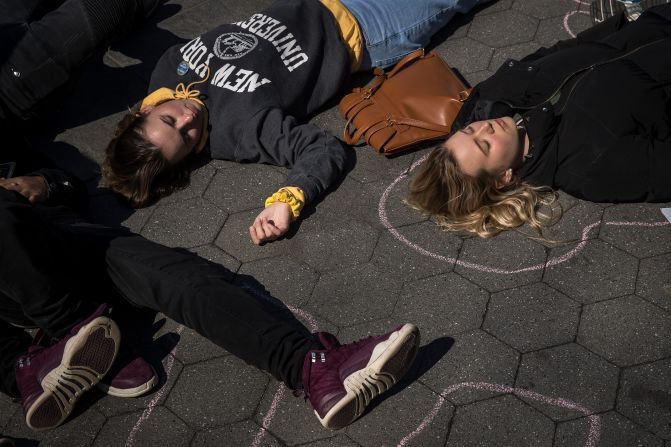 Student activists participate in a "die-in" to protest gun violence at Washington Square Park in New York.