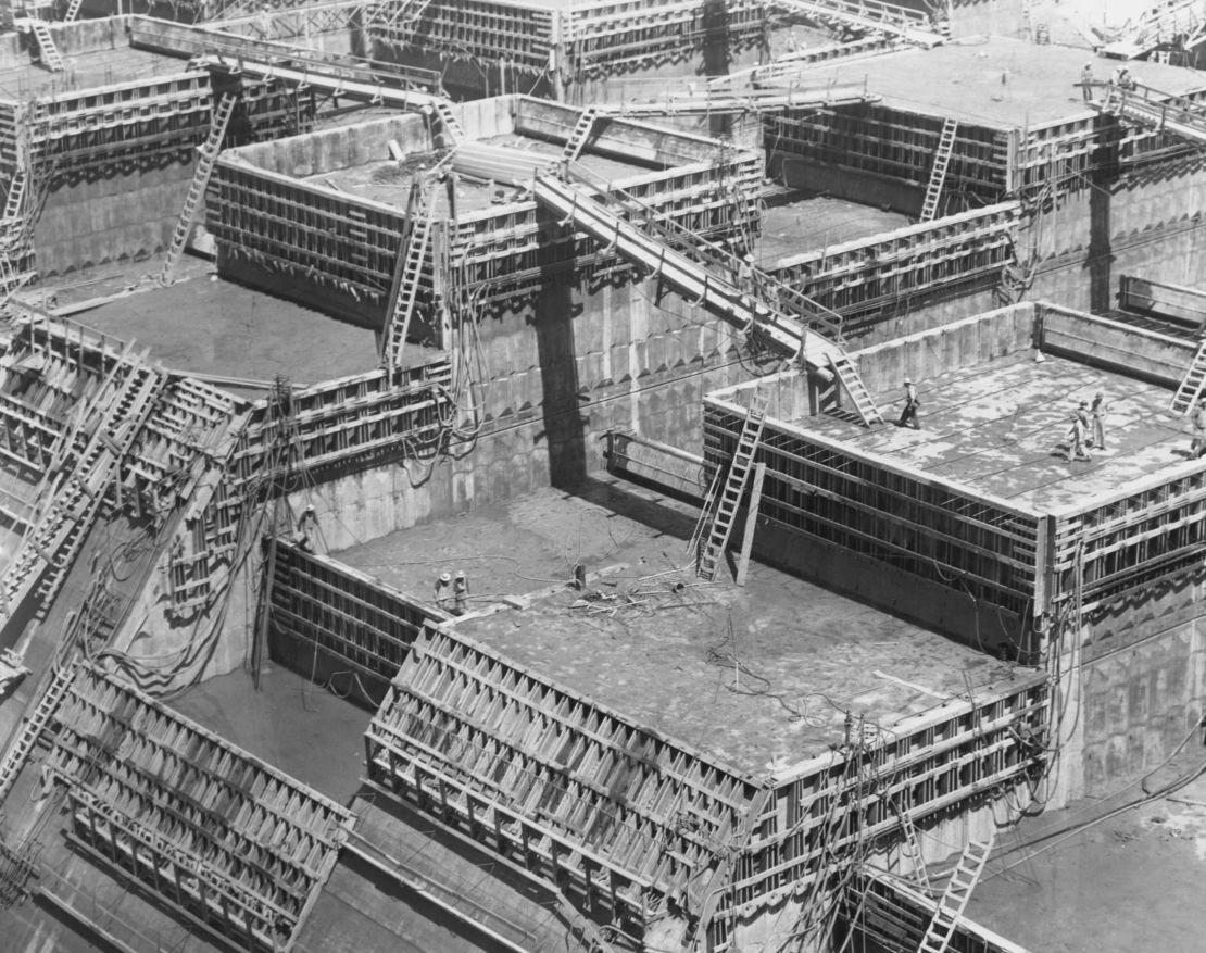 Workers pour concrete in the US, circa 1940. 