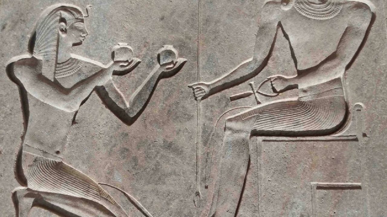 Carving of Psamtik I and creator god Atum.