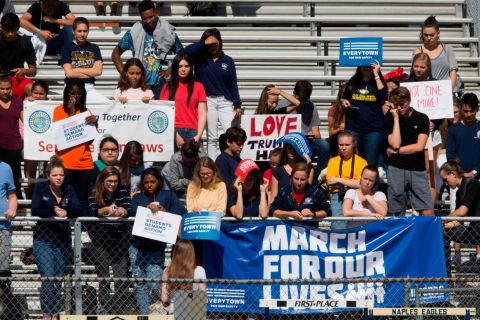 Students at Naples High School, in an effort to revive action on gun reform, walk out of school in Naples, Florida.