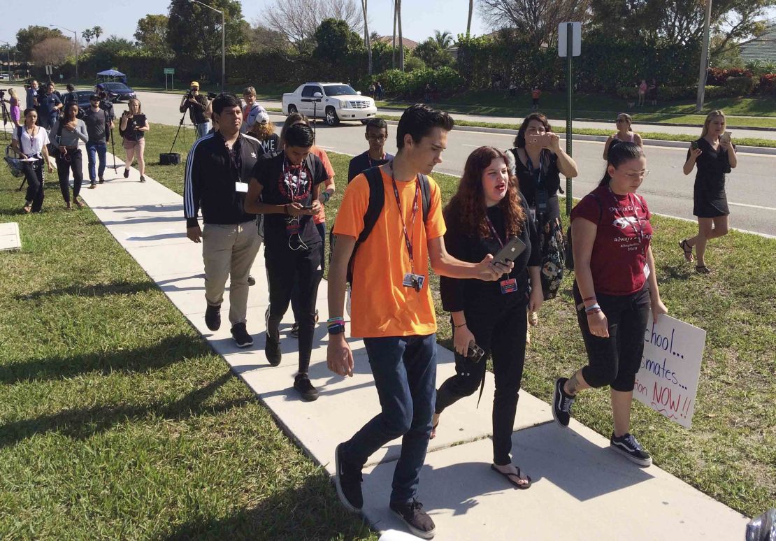 Activist David Hogg, left, and other Parkland students join in the national walkout Friday. 