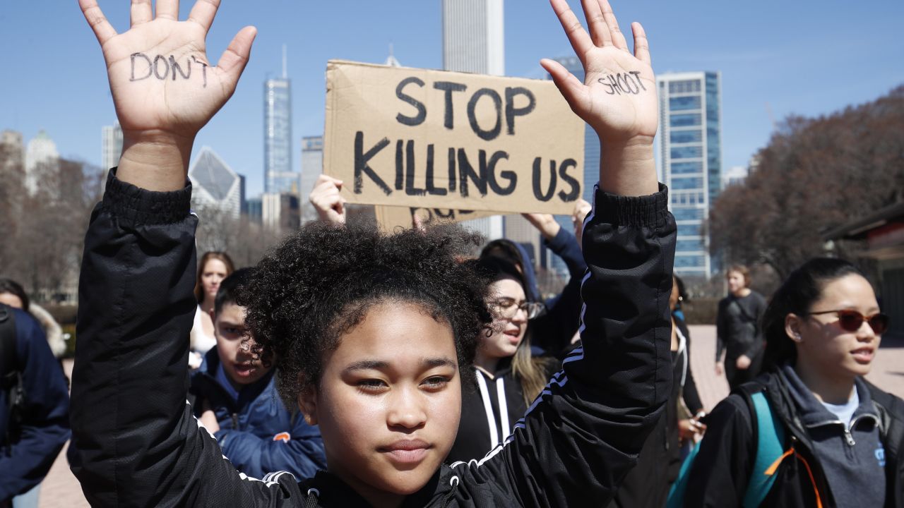 CHICAGO, IL - APRIL 20: A student holds up her hands while taking part in National School Walkout Day to protest school violence on April 20, 2018 in Chicago, Illinois. Students from around the nation joined in the walkout against gun violence on the 19th anniversary of the shooting at Columbine High School where 13 people were killed. (Photo by Jim Young/Getty Images)