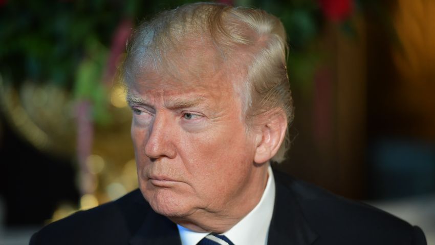TOPSHOT - US President Donald Trump listens to Japanese Prime Minister Shinzo Abe as he arrives for talks at Trump's Mar-a-Lago resort in Palm Beach, Florida, on April 17, 2018. / AFP PHOTO / MANDEL NGAN (Photo credit should read MANDEL NGAN/AFP/Getty Images)