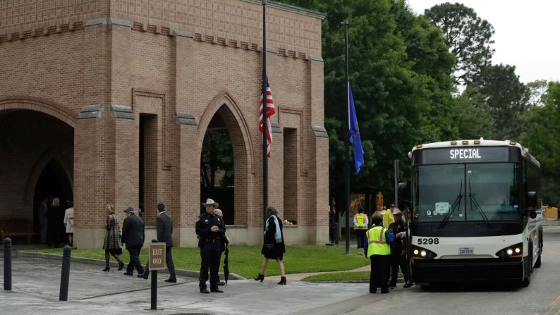 Attendees arrive at St. Martin's Episcopal Church for the funeral service. 