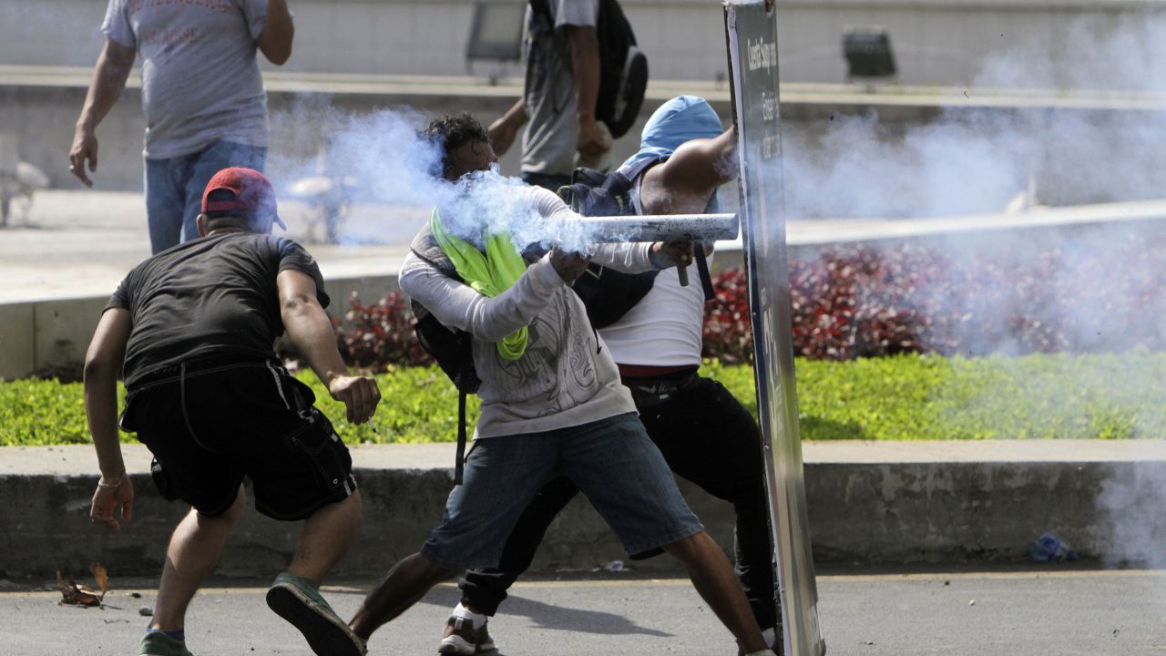 Students clash with riot police during a protest against the government's social security reforms in Managua, Nicaragua.