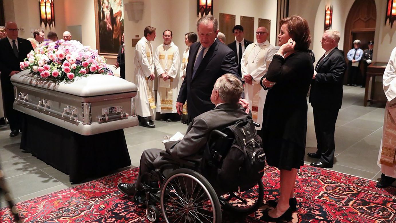 Former presidents George H.W. Bush and George W. Bush in front of the casket of their wife and mother, former first lady Barbara Bush.