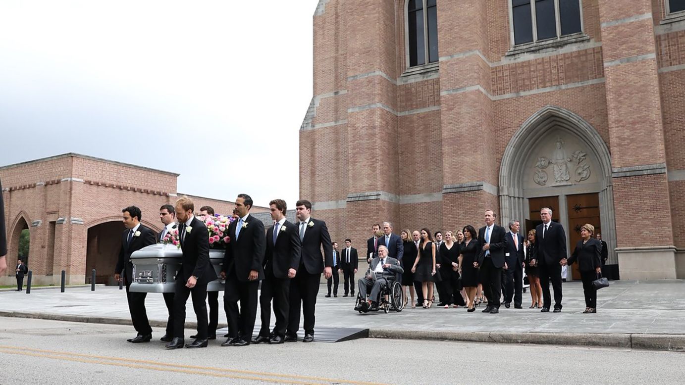 The casket of the former first lady Barbara Bush is carried out of the church by her grandsons in Houston on Saturday.