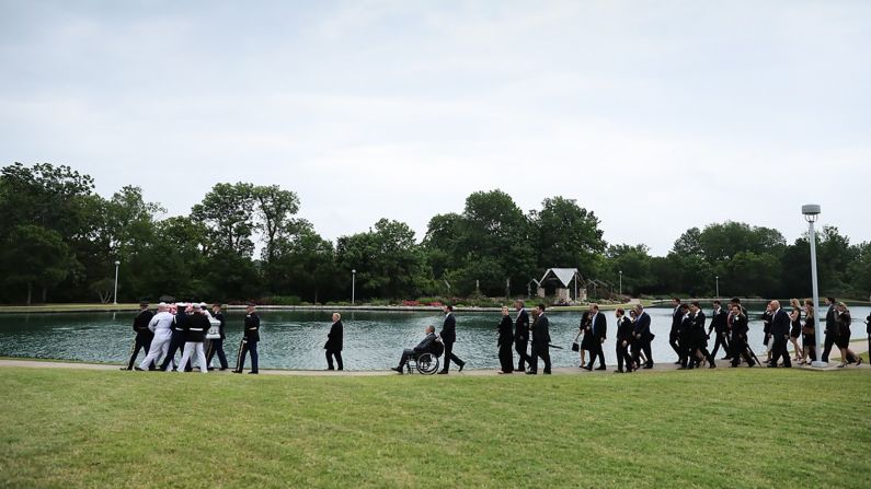 The casket of former first lady Barbara Bush is walked to its internment site.