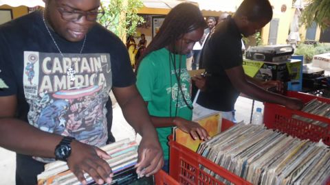 Record collectors digging for vinyl in The Time Machine Zambia, a pop up vinyl store in the capital of Zambia, Lusaka.