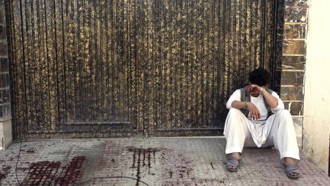 A relative of a victim cries outside a voter registration center which was attacked by a suicide bomber in Kabul, Afghanistan, Sunday, April 22. 