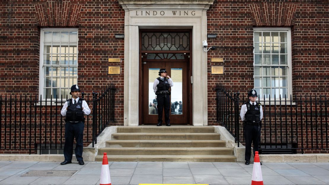 Police officers stand guard outside the Lindo Wing of St Mary's Hospital ahead of the birth.