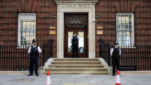 Police officers stand guard outside the Lindo Wing of St Mary's Hospital ahead of the birth.