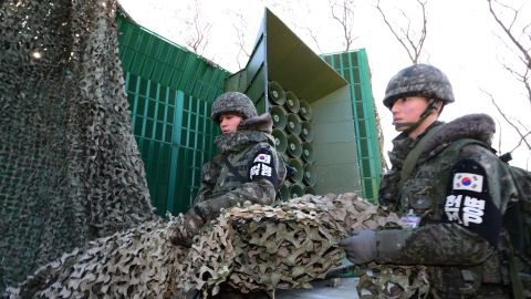 South Korean soldiers drow down a cover from the loudspeakers at a military base near the border between South Korea and North Korea on January 8, 2016 in South Korea.